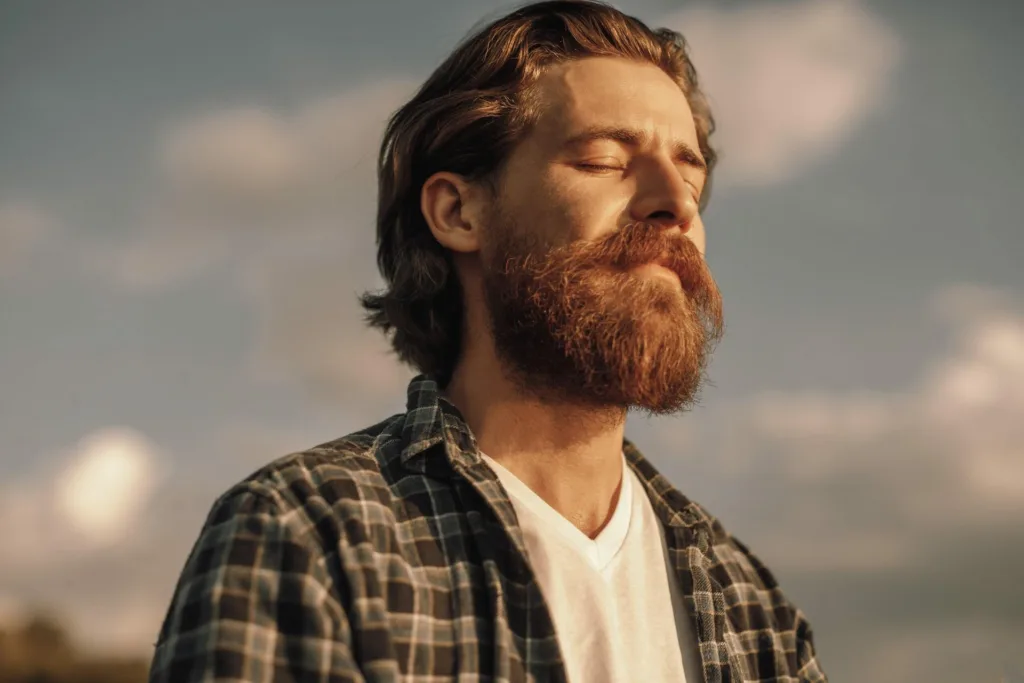calm-man-meditating-in-sunny-summer-day-img