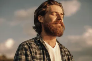 calm-man-meditating-in-sunny-summer-day-img